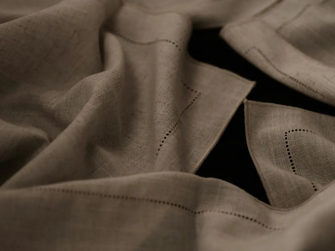 Close-up of natural linen with a hemstitched border
