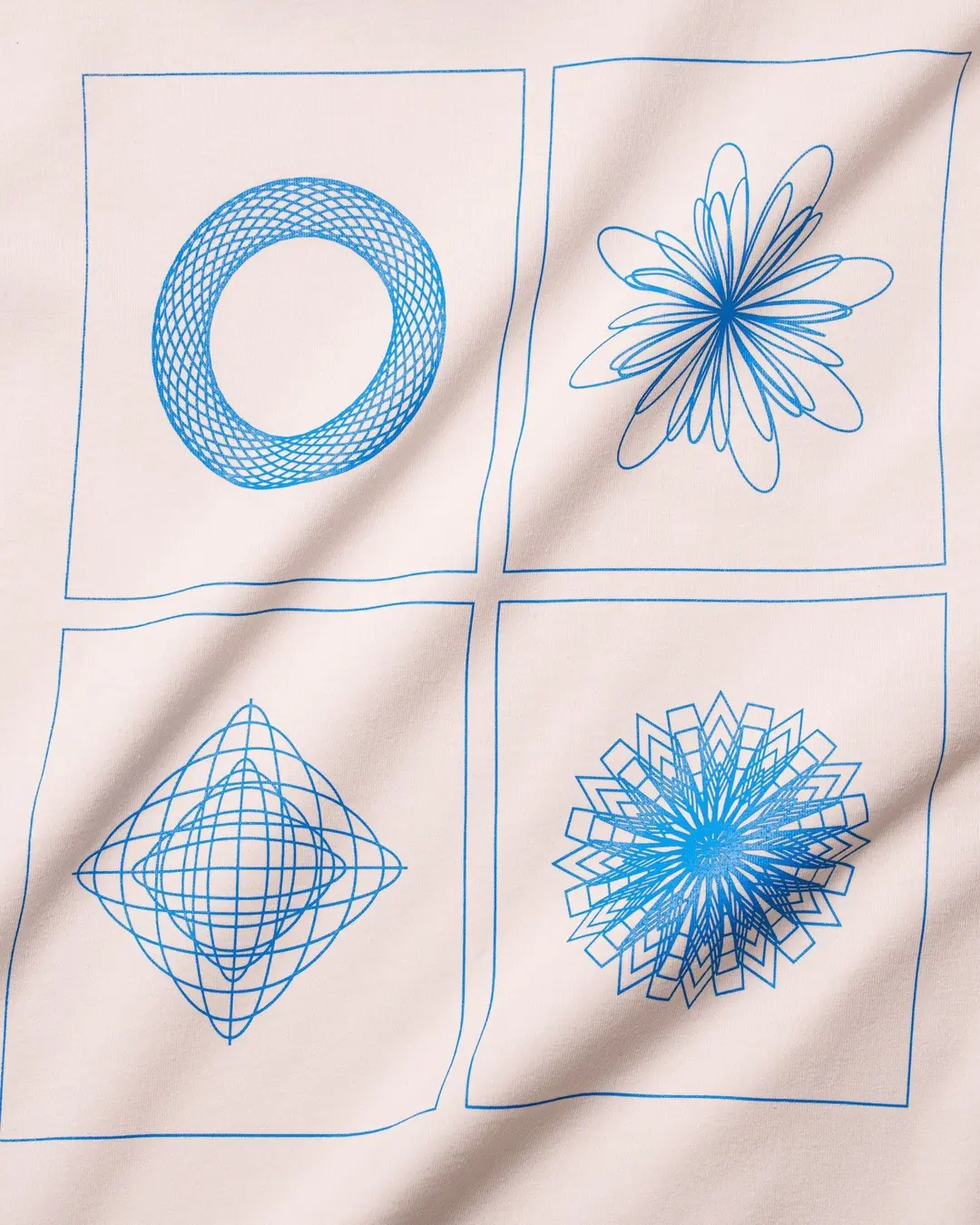 Four line-print test patterns in blue on a light cotton sample